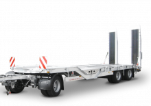 Przyczepy niskopodwoziowe Schwarzmüller 3-axle low loader trailer with wheel recesses for transporting construction machinery